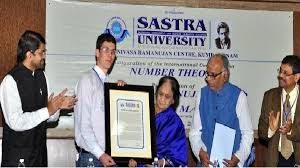 The 2019 Sastra-Ramanujan Prize will be awarded to number theorist Adam Harper of the University of Warwick, England, according to a statement issued by the Sastra Deemed to be University. This annual prize is given to honour outstanding contributions by individuals not exceeding age of 32 in areas of mathematics, influenced by Indian mathematician Ramanujan. Daily Current Affairs Quiz 2019 The prize, which includes a cash award of USD 10,000 and a citation, will be awarded at the international conference on number theory scheduled for December 22 (Ramanujan’s birthday) on the campus of the institution in Kumbakonam. The international prize committee comprised six outstanding mathematicians across three continents headed by Alladi Krishnaswami from the University of Florida.