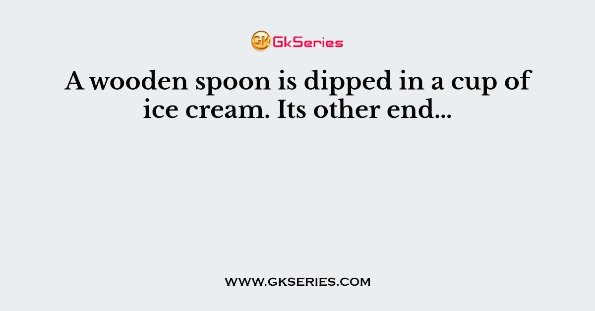 A wooden spoon is dipped in a cup of ice cream. Its other end…